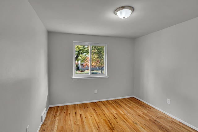 spare room with light hardwood / wood-style flooring