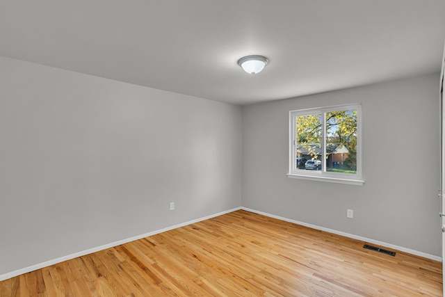 unfurnished room with light hardwood / wood-style floors