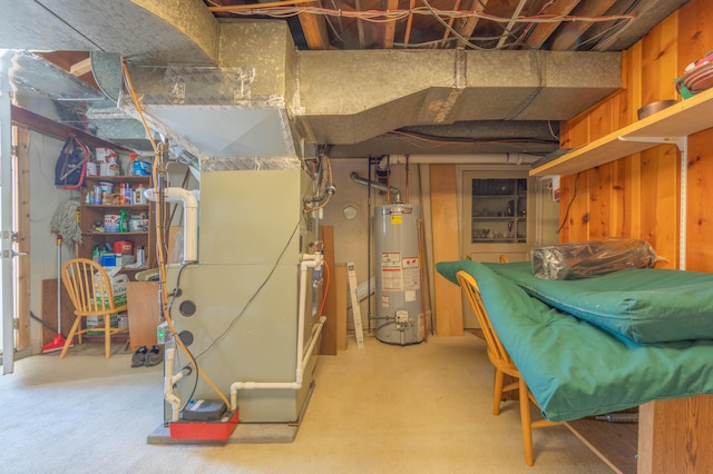 basement featuring gas water heater and heating unit