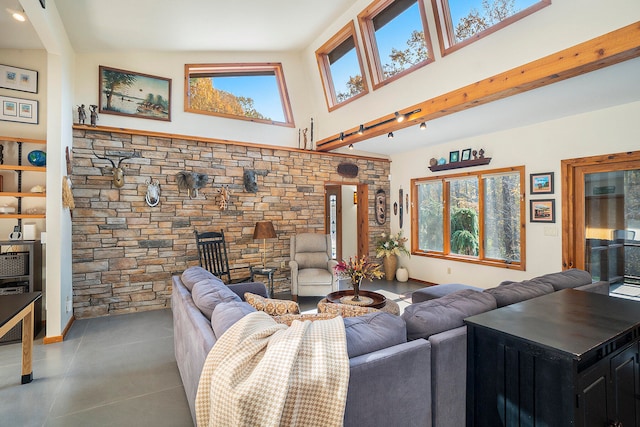 living room with a wealth of natural light and lofted ceiling