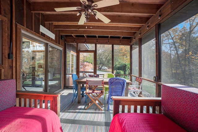 sunroom / solarium featuring ceiling fan