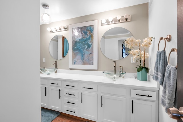 bathroom with tile patterned floors and vanity