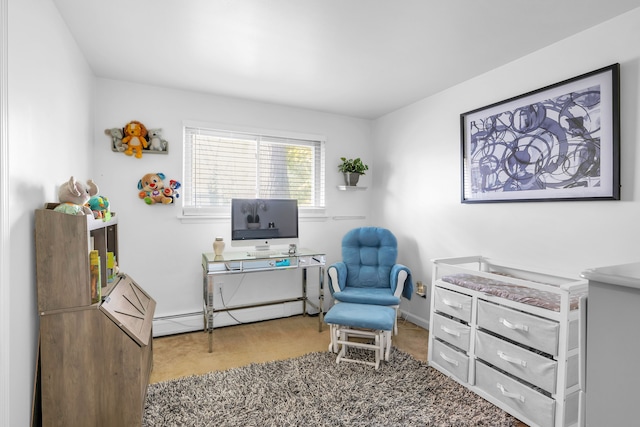 sitting room featuring light carpet and a baseboard heating unit