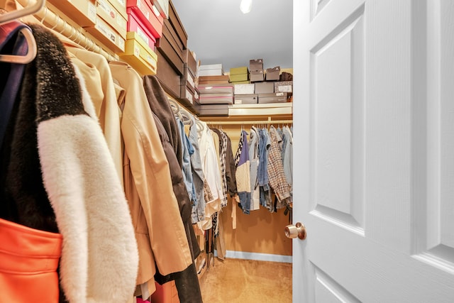 walk in closet featuring carpet