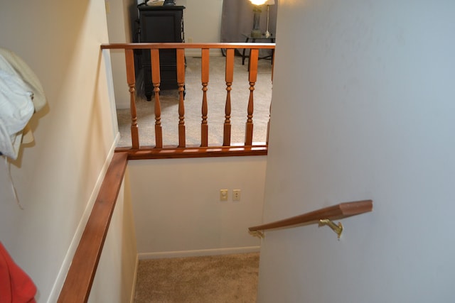 stairs with carpet flooring