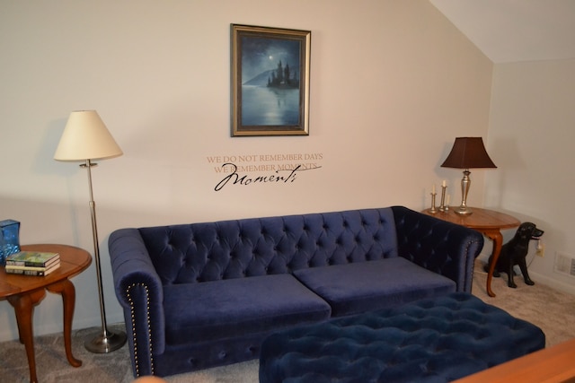 living room with vaulted ceiling and carpet floors