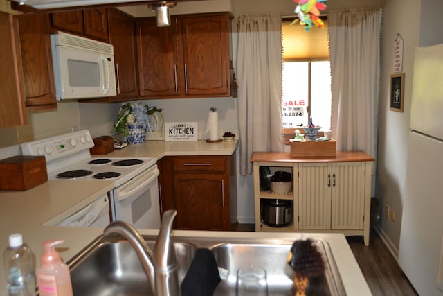 kitchen with white appliances and sink