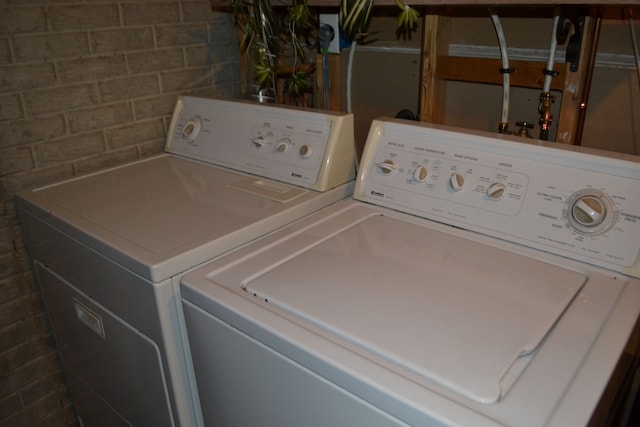 laundry area with independent washer and dryer