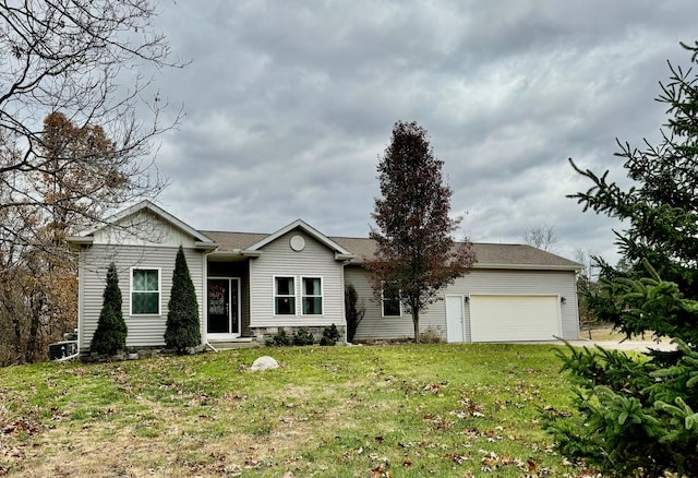 ranch-style home featuring a front yard and a garage