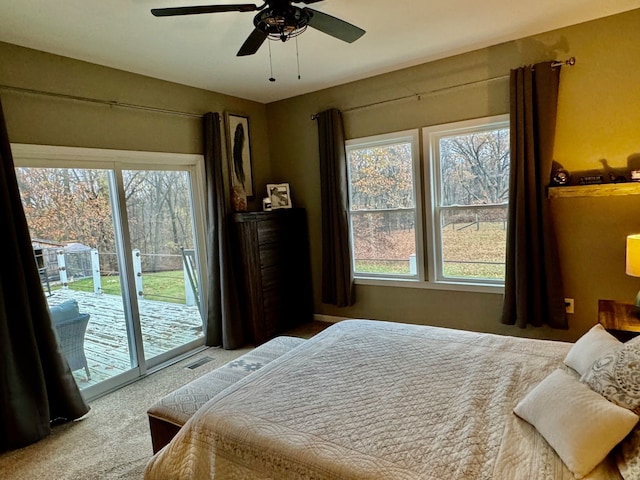 carpeted bedroom featuring access to outside and ceiling fan