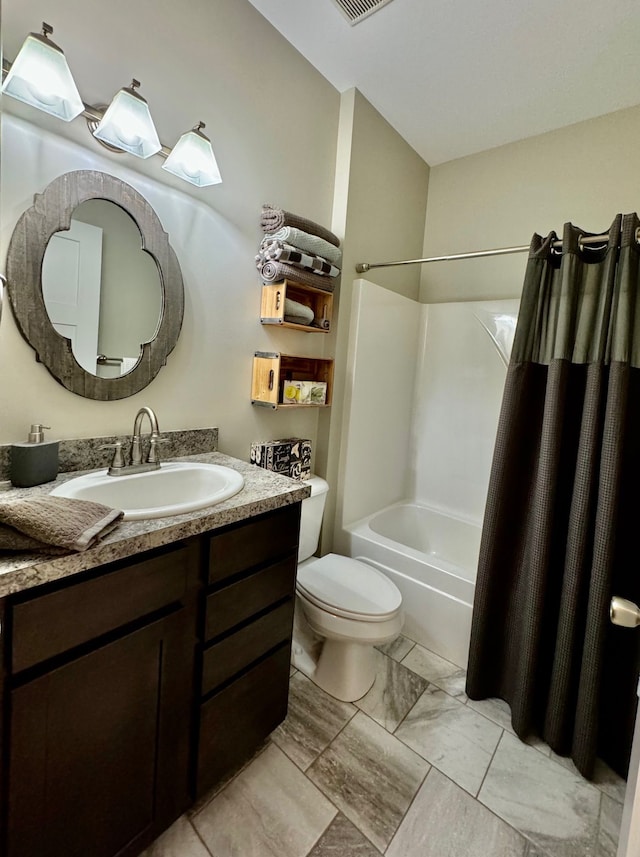 full bathroom with shower / tub combo with curtain, vanity, and toilet