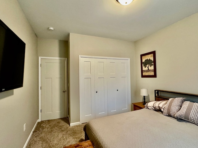 carpeted bedroom with a closet