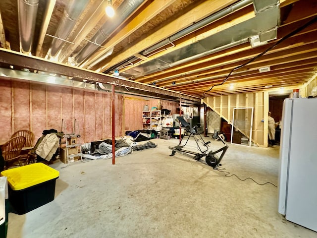 basement with white refrigerator