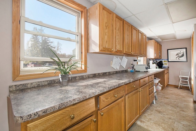 kitchen featuring a paneled ceiling