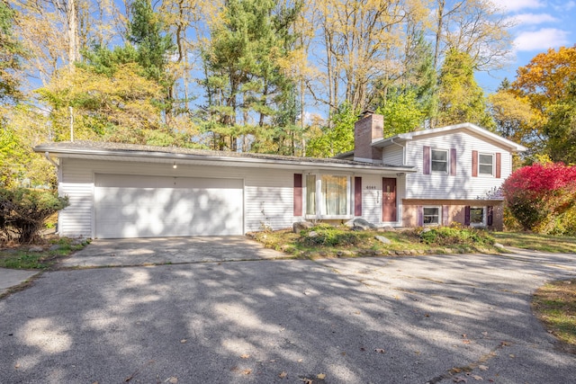 split level home featuring a garage