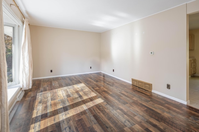 empty room featuring dark wood-type flooring