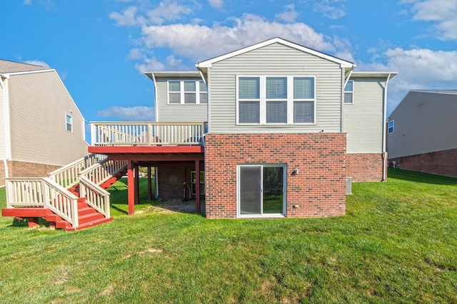 rear view of property with a lawn and a deck