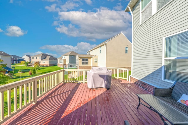 wooden terrace with a grill