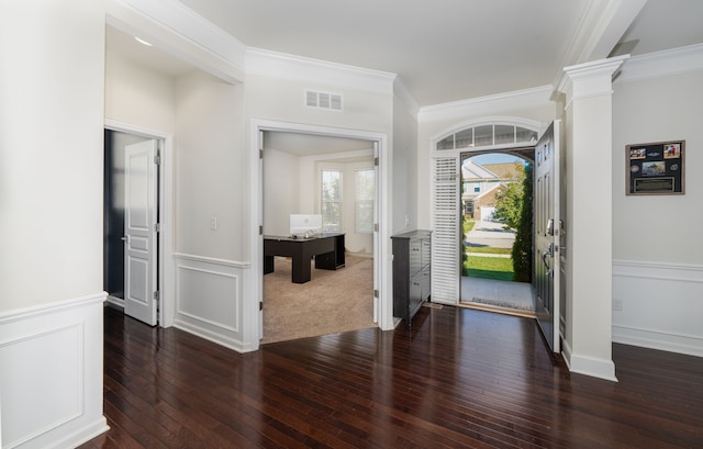 entrance foyer featuring dark hardwood / wood-style floors and ornamental molding