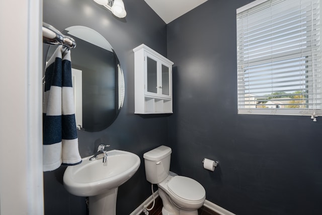 bathroom with toilet and sink