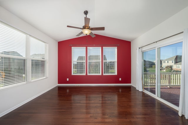 empty room featuring dark hardwood / wood-style flooring and a healthy amount of sunlight