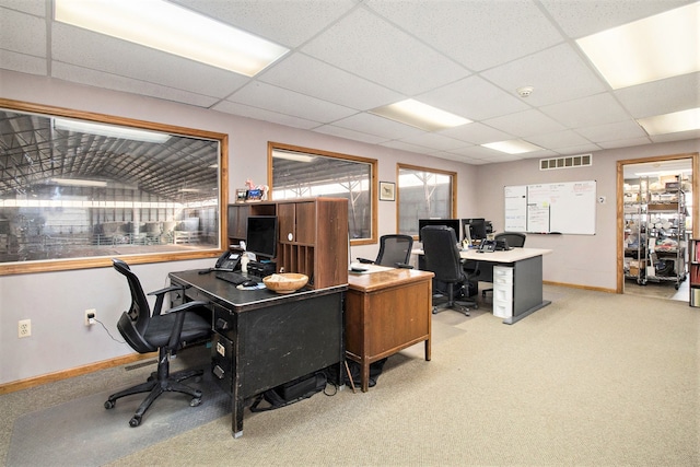 office with light carpet and a paneled ceiling