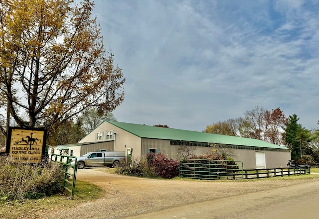 view of home's exterior featuring an outbuilding