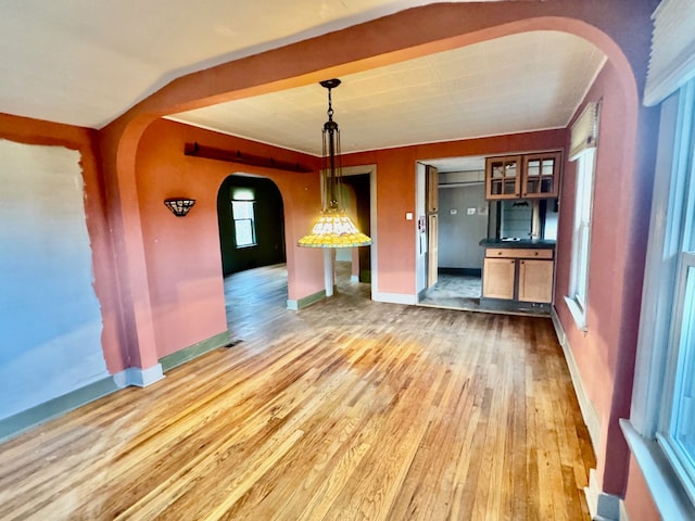 kitchen featuring pendant lighting and light wood-type flooring