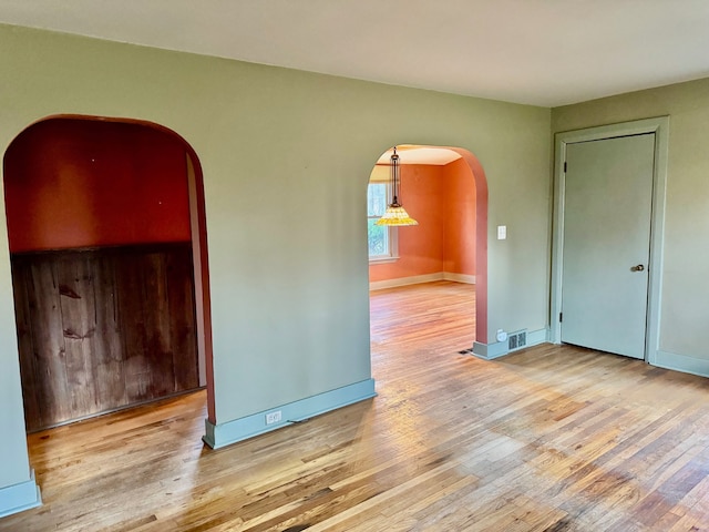 spare room featuring light wood-type flooring