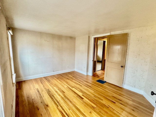 empty room featuring hardwood / wood-style flooring