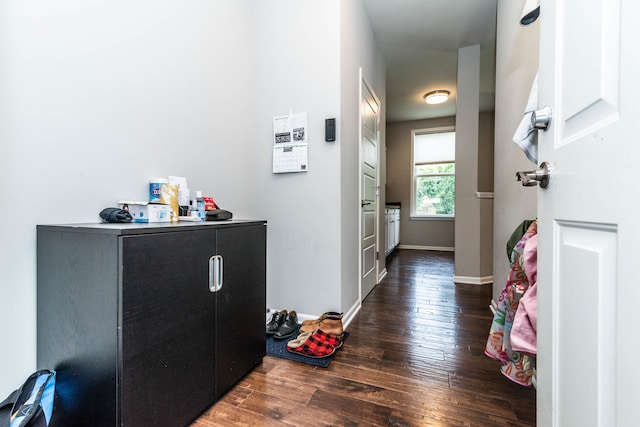 hall with dark wood-type flooring