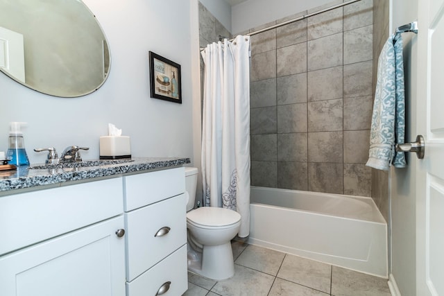 full bathroom featuring toilet, vanity, tile patterned flooring, and shower / bath combo with shower curtain