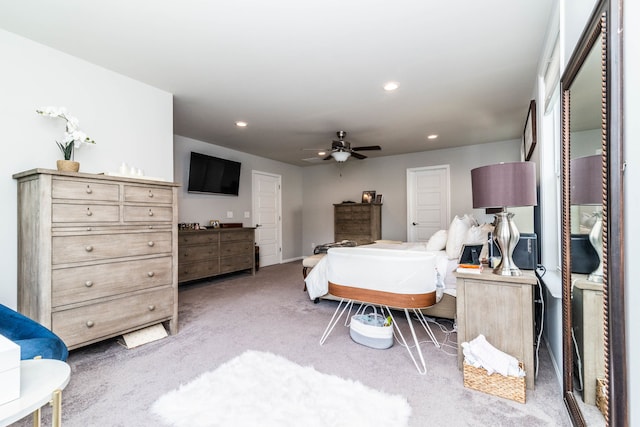 bedroom featuring ceiling fan and carpet