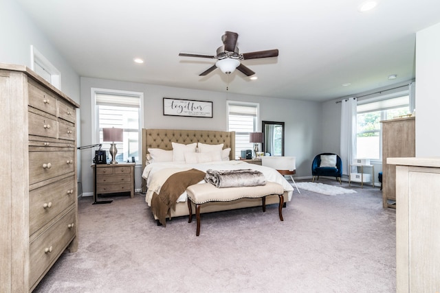 carpeted bedroom with ceiling fan