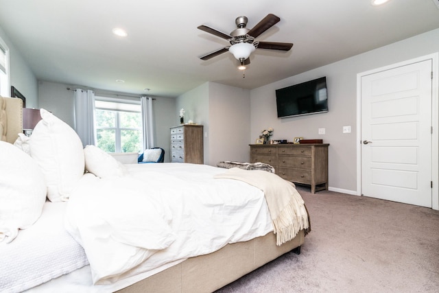 bedroom with ceiling fan and carpet floors