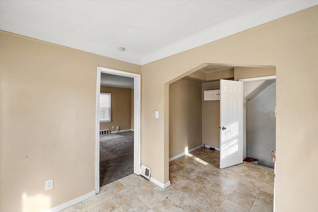 interior space with a textured ceiling