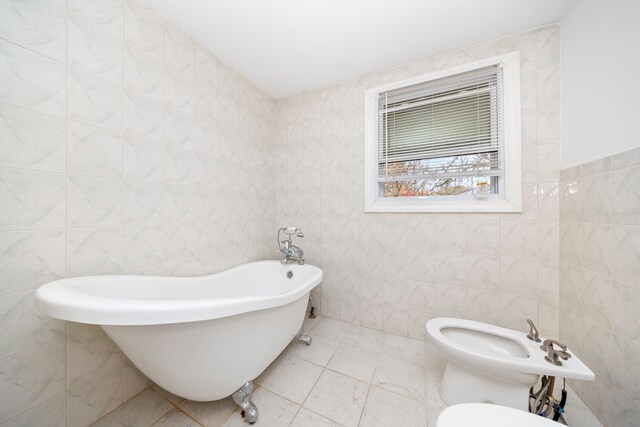 5731 Farmington Rd, West Bloomfield, MI 48322 - bathroom featuring tile walls, a soaking tub, a bidet, and toilet