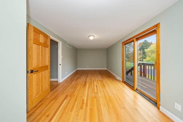 unfurnished room featuring light wood-type flooring