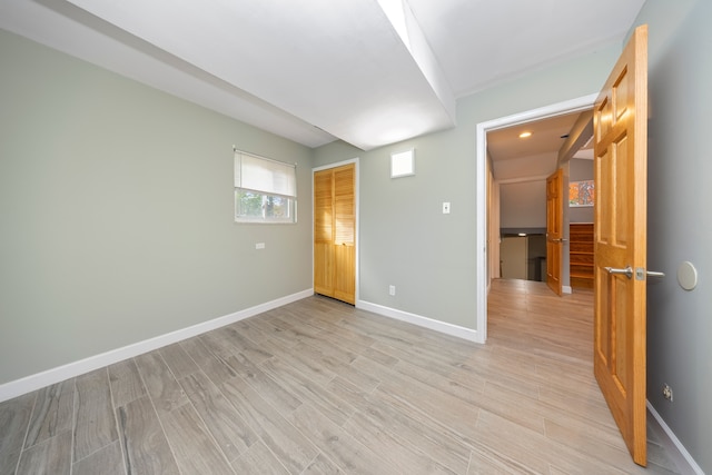 unfurnished room featuring light hardwood / wood-style floors