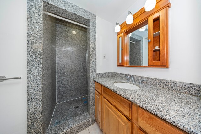 5731 Farmington Rd, West Bloomfield, MI 48322 - bathroom featuring a shower stall, vanity, and tile patterned flooring