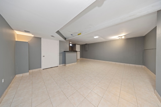 basement with light tile patterned floors