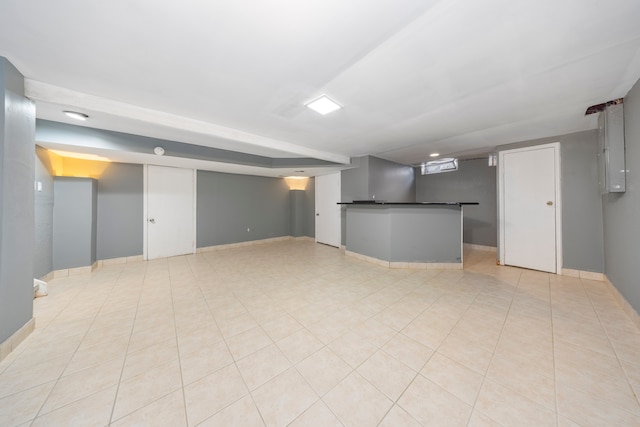 unfurnished living room featuring light tile patterned floors