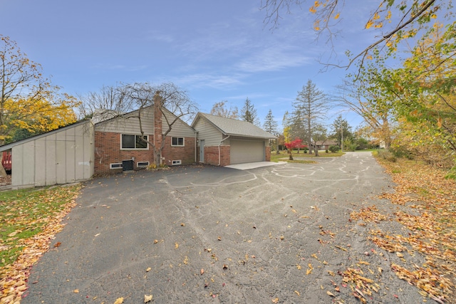 view of property exterior with a garage