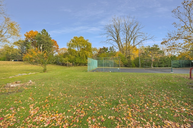 view of yard with tennis court