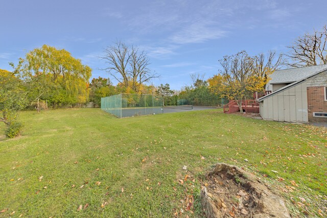 5731 Farmington Rd, West Bloomfield, MI 48322 - view of yard featuring a deck and an outbuilding