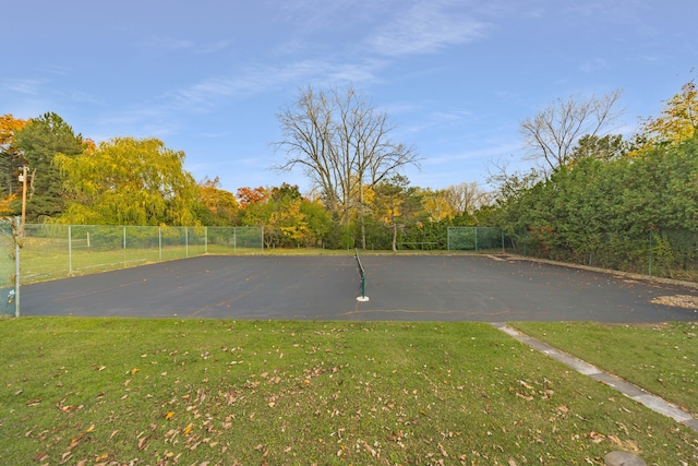 view of basketball court featuring a lawn