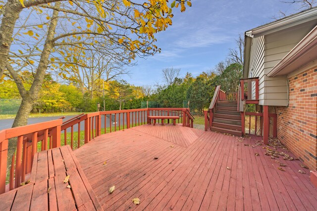 5731 Farmington Rd, West Bloomfield, MI 48322 - wooden deck featuring stairway and view of scattered trees