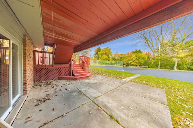 view of patio with tennis court