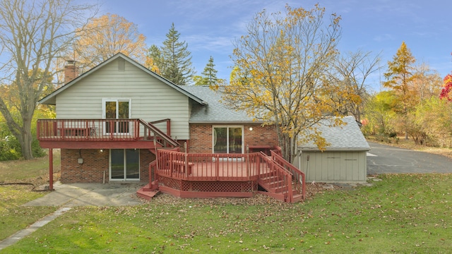 back of house with a lawn, a patio, and a deck