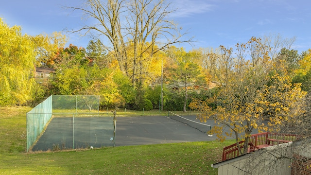 view of sport court featuring tennis court